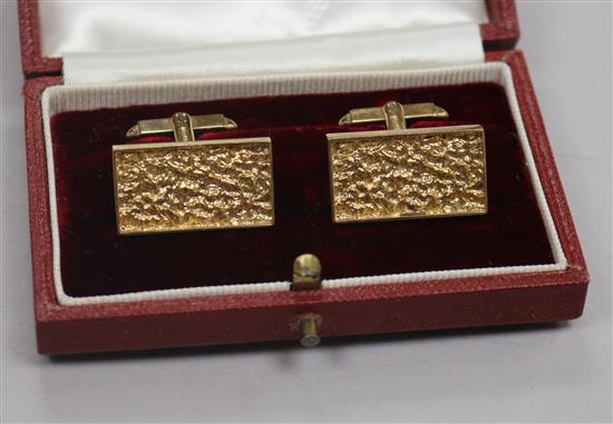 A pair of early 1970s textured 9ct gold rectangular cufflinks, in Aspreys box, 24mm.